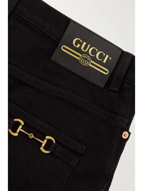 jeans gucci scritte